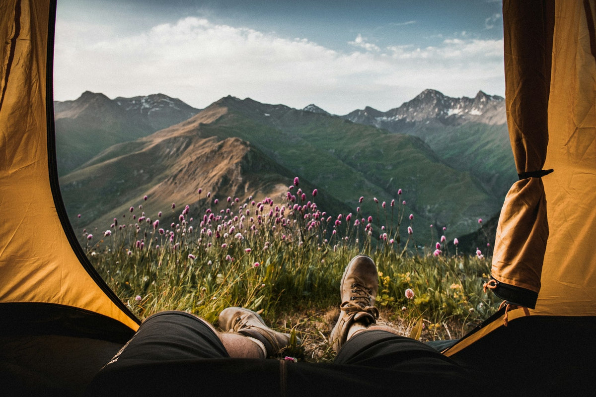 View of alpine mountains from inside a warm tent